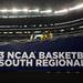 Michigan fans lean on a railing in the stands above a sing that reads "2013 NCAA basketball South Regional" before the the start of the Wolverine's Sweet 16 match up against Kansas at Cowboys Stadium in Arlington, Texas on March 29, 2013. Melanie Maxwell I AnnArbor.com